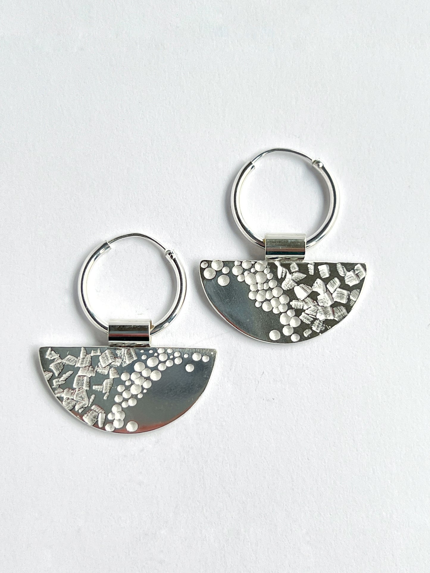half moon disc hoops laying flat on a white background