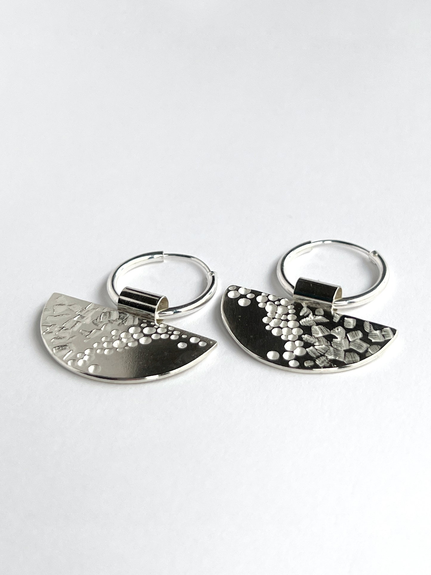 half moon disc hoops laying flat facing left on a white background