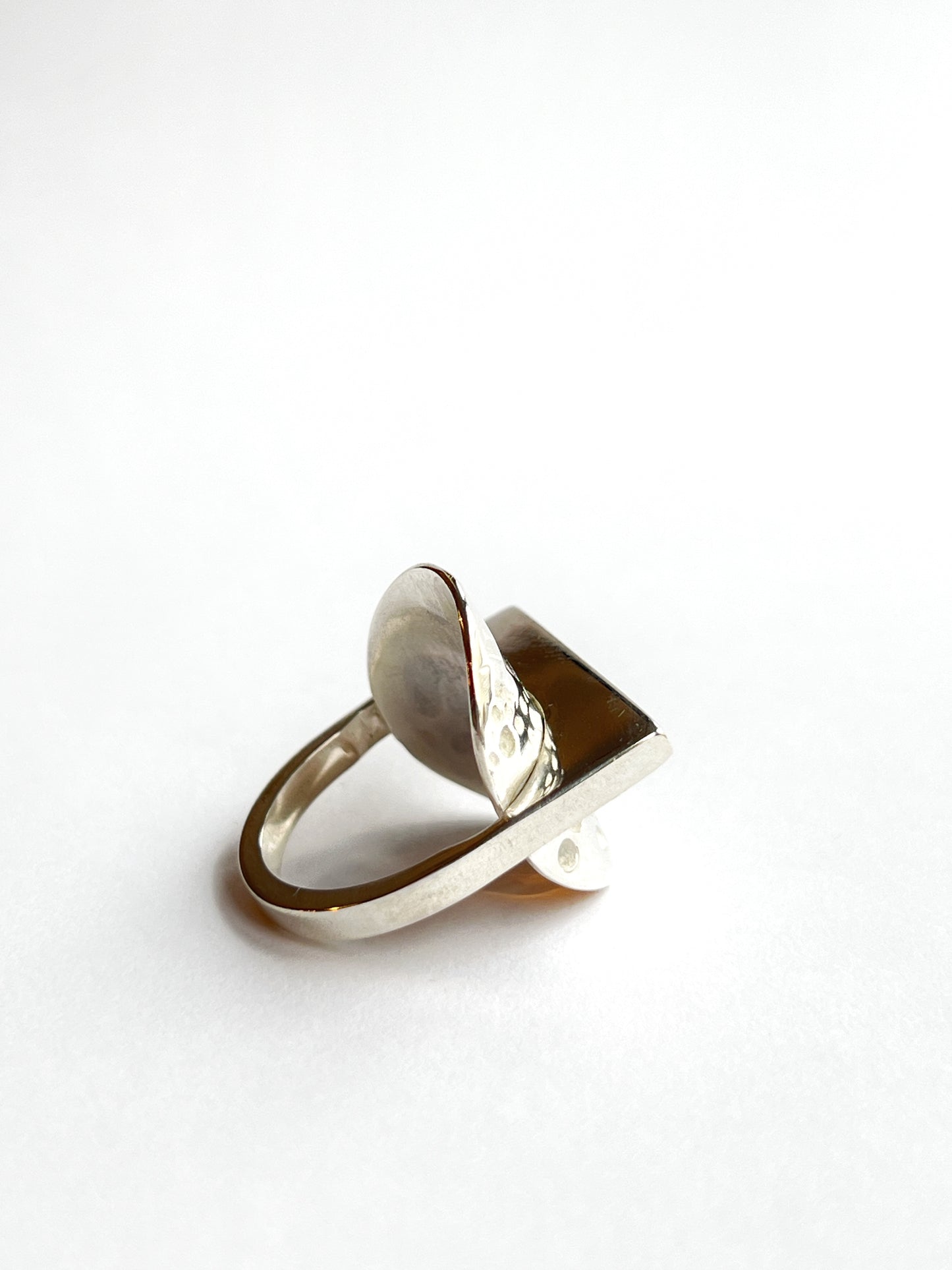 side back angle of a circle ring with small thin rectangle bar in the middle on a white background, facing back right