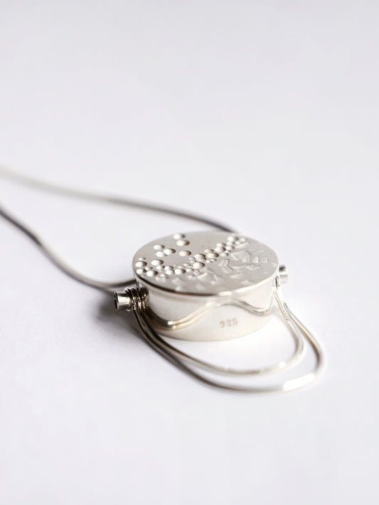 Silver large box pendant with snake chain detail on white background