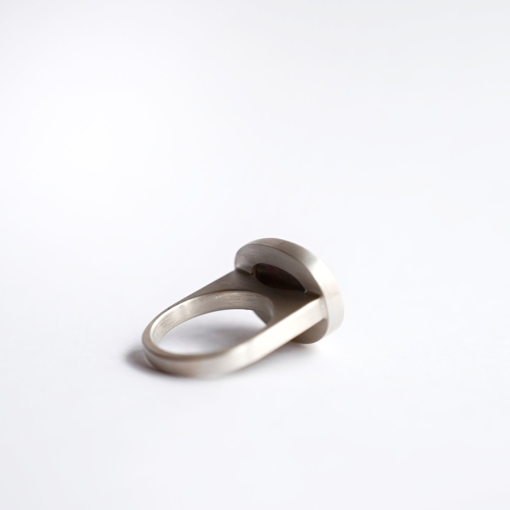 Back view of silver component ring with mabe pearl 1 on white background