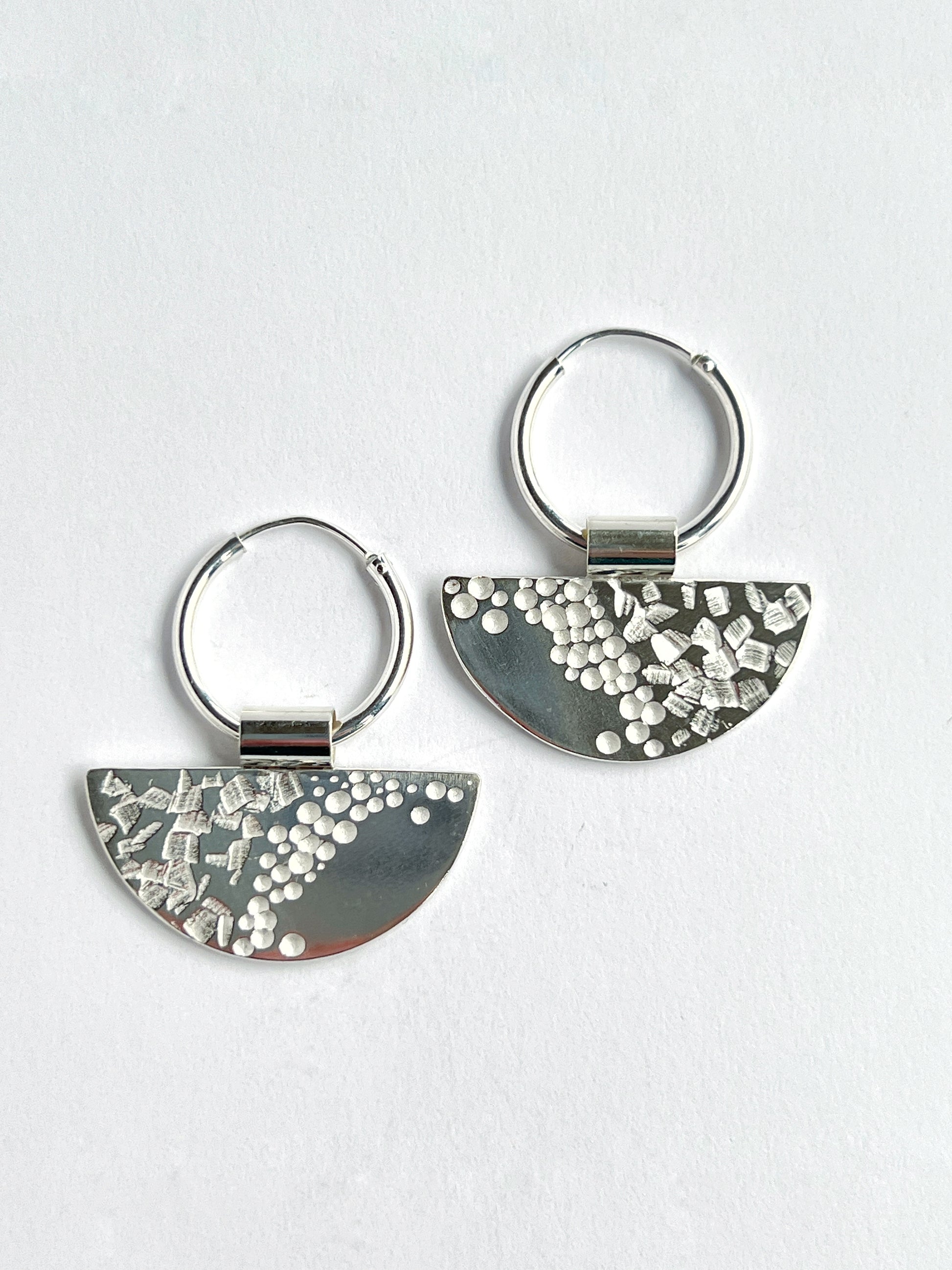 half moon disc hoops laying flat on a white background